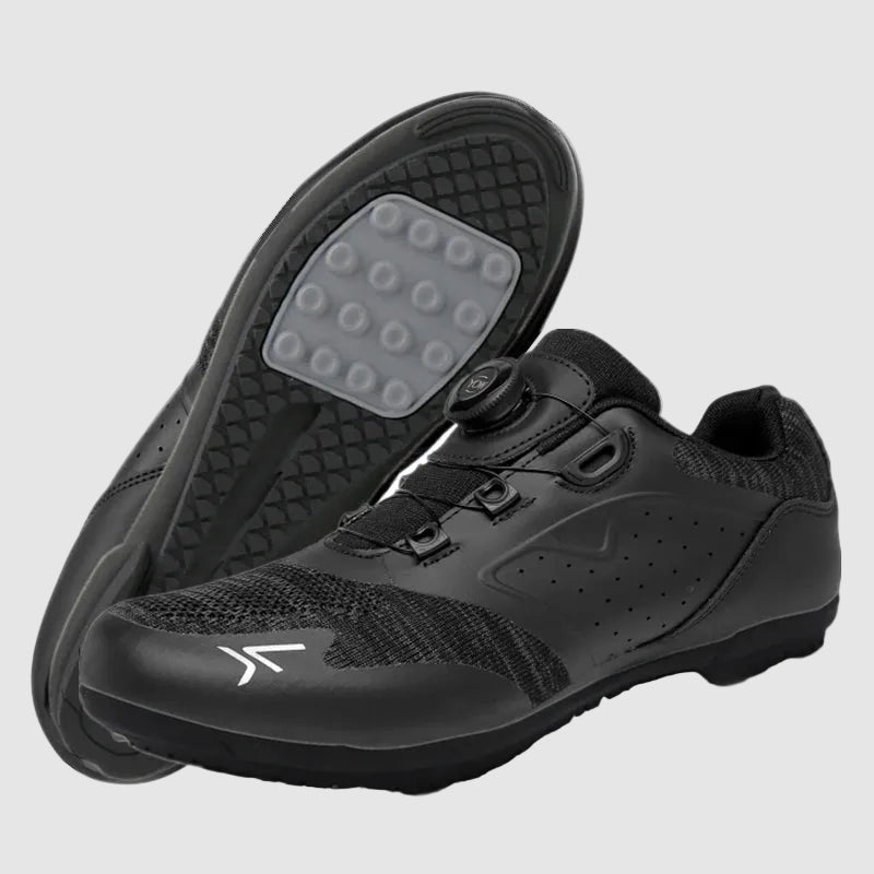 Black cycling shoes with sole showing on a white background