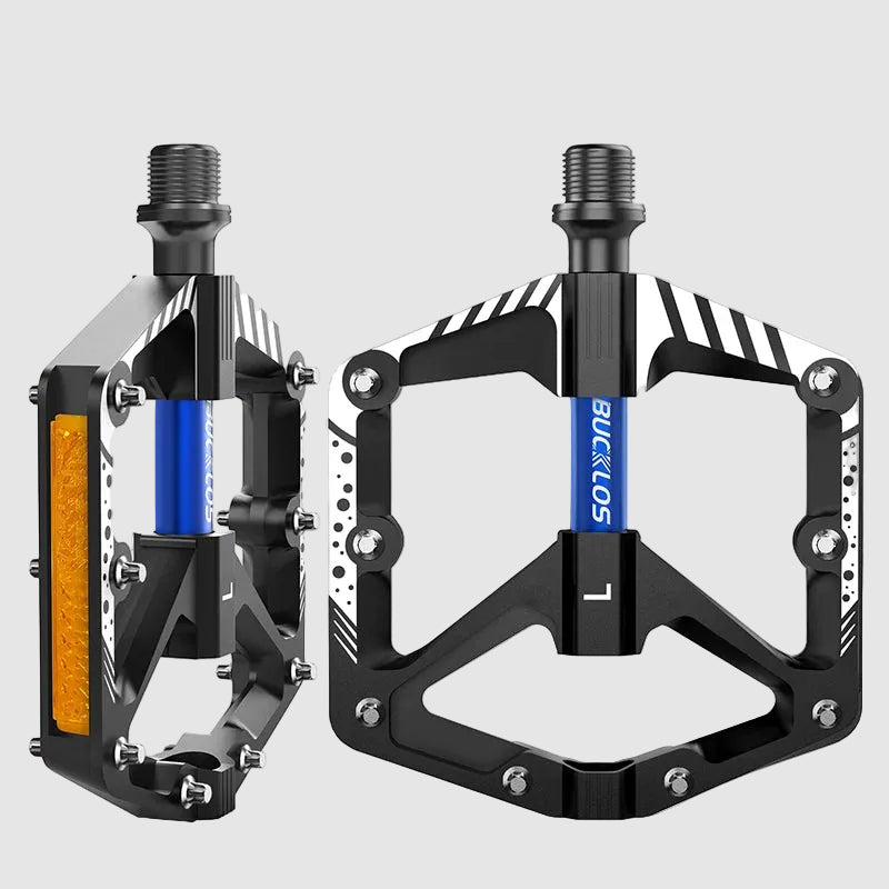 Pair of black bicycle pedals with orange and blue accents on a white background, featuring the Bucklos brand.