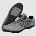 Gray and black camouflage shoes with a visible brand logo on a white background