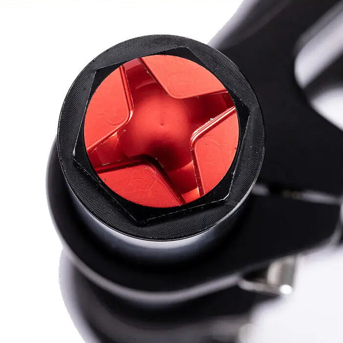 Close-up of a black air chamber with a red interior on a white background.